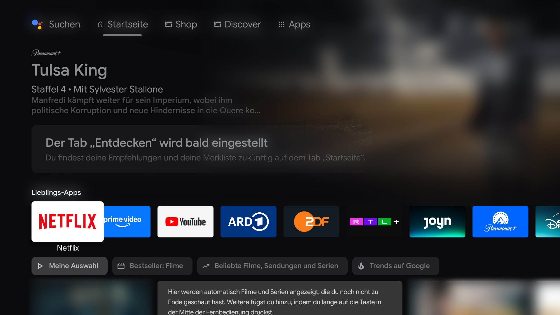 Android-TV-Startbildschirm auf einem TCL-Fernseher mit den Reitern Suchen, Startseite, Shop, Discover und Apps, einem großen Werbebild für die Paramount+-Serie Tulsa King und den Lieblings-Apps darunter